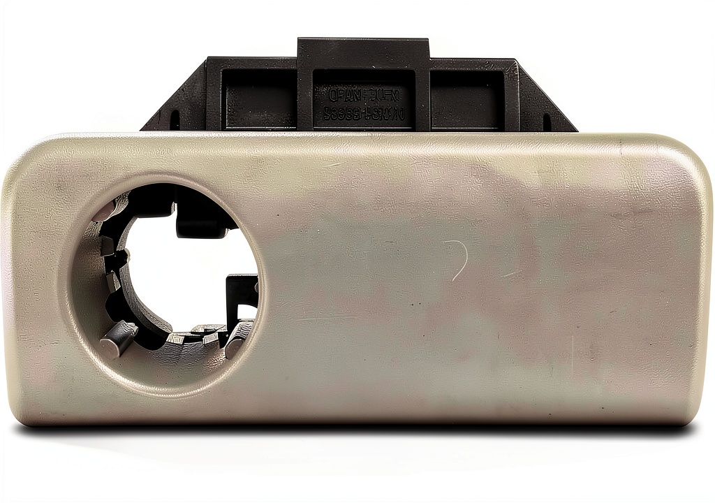 Installing gray glove box latch handle in a Toyota Sienna interior